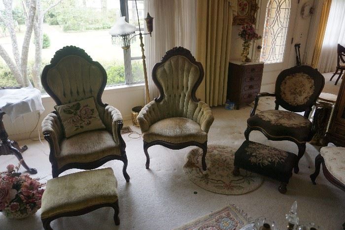 Victorian tufted high backed arm chairs with footstool.