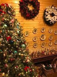 A Christmas tree filled with hundreds of vintage decorations. Several wreaths, Hummel Christmas plates and Hummel  figurines, some of very early examples from Germany 