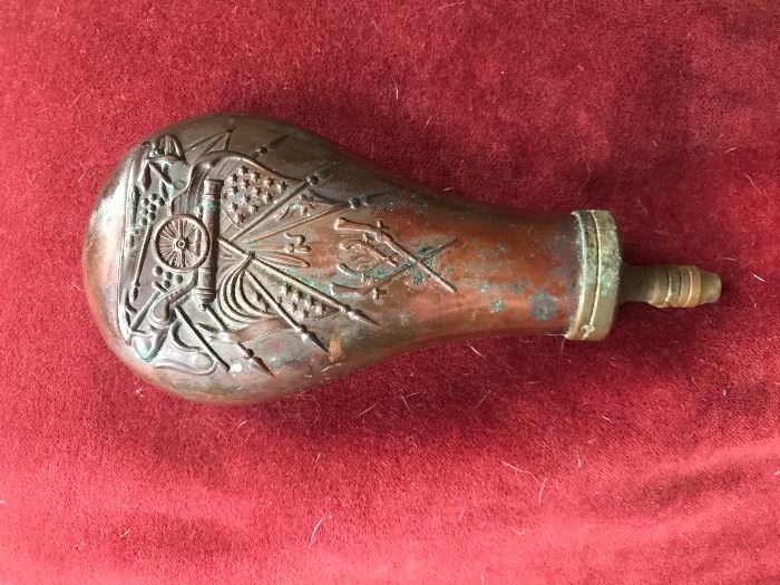 The powder flask to the rifle, copper and interesting enough made in Italy