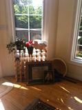Artwork, wine rack, artificial flowers, basket