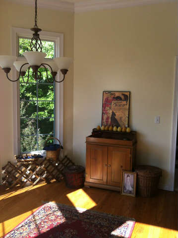 Dry sink, wine rack, artwork and oriental rug.