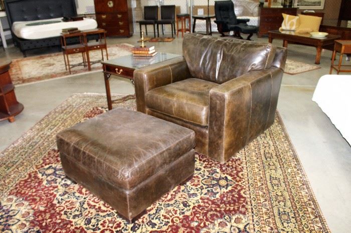 Crate and Barrel brown distressed leather arm chair and ottoman