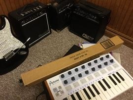 Keyboard and music stand, small amps.