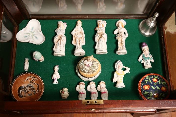 Collection of bisque figures and porcelain doll heads.
