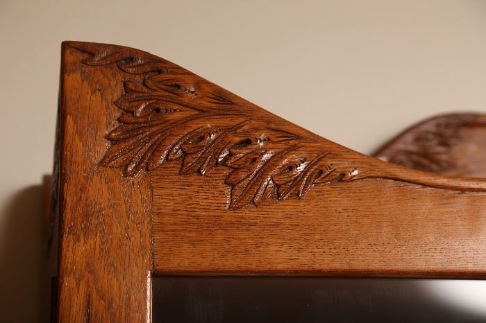 Detail of carving on bookcase.