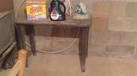 Several primitive Pine tables in the basement