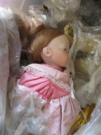 5 cartons of old and new dolls to unpack.