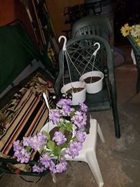 Outdoor chairs, fake flowers and hanging baksers
