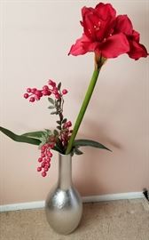 Silver vase with red flower