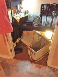 Unused picnic basked/table.  Plates, utensils, wine glasses, wine opener...opens to create a table.