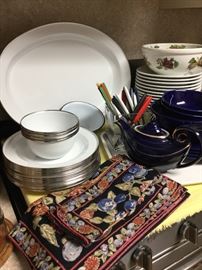 White enamelware plates, cups, large platter