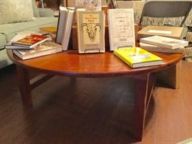   Handcrafted mesquite table by David Clifton. Performs double duty. Lowered it is a stunning coffee table. Lifts to become a dining table, as well. Gorgeous! 