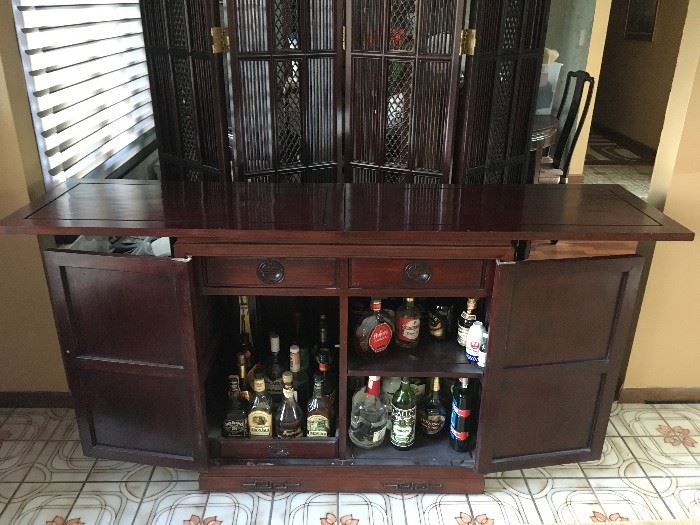 The bar that is part of the dining room set. This photo shows it fully opened and ready for entertainment.