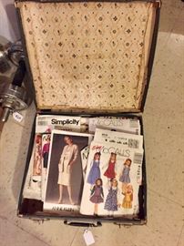 Vintage suitcase full of dress patterns