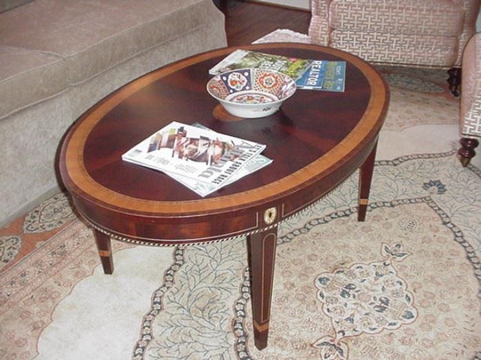 Oval banded mahogany coffee table
