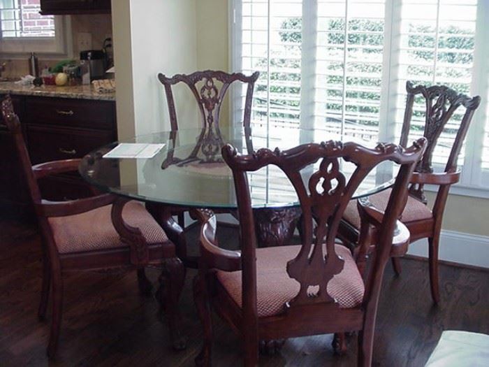 Glass top dining table and four Chinese Chippendale style chairs