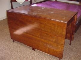 Beautiful early drop leaf table with demilune ends, pegged, that slip right into the end leaves.