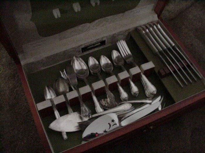 Silverplated flatware in silver chest