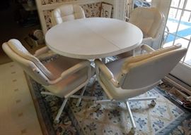 Breakfast table has 5 chairs, but only 4 are shown