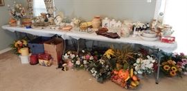 Lots of floral arrangements and candles