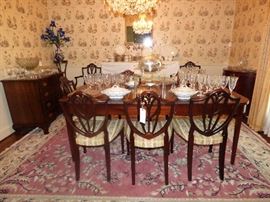 "Prince of Wales" Shield back dining chairs (6 plus 2 armchairs), mahogany dining table with 2 leaves.