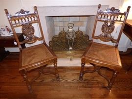 Carved Griffons splat, caned seat chairs, brass fireplace fender, fan, andirons