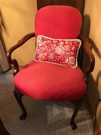 Red upholstered wood armchair 