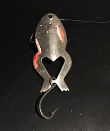Vintage Heddon spoon-y frog fishing lure with a little bit of the original paint still remaining