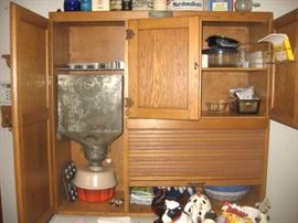 Oak Hoosier-style cabinet with internal mechanism, McDougall brand