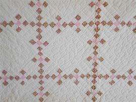 CLOSE-UP OF ANTIQUE QUILT