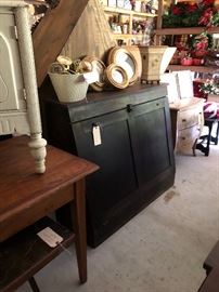 solid dark wood chest; port hole mirrors