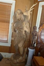Carved wooden Indian carrying deer - lifesize - approx 6 ft tall