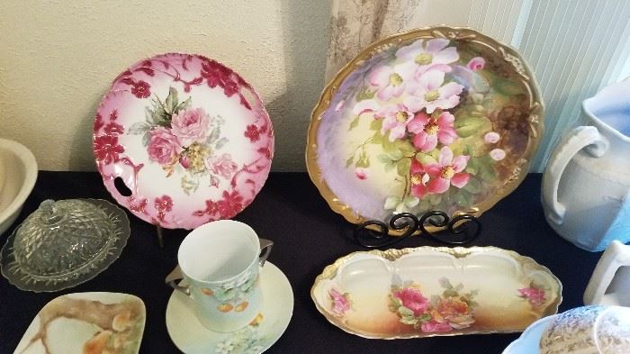 Many painted plates and other china