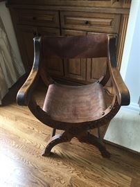 Pair of carved antique Brazilian campaign chairs. 