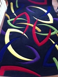 5X8 beautiful "like new" area rug. Perfect for a game room or even a child's play room.