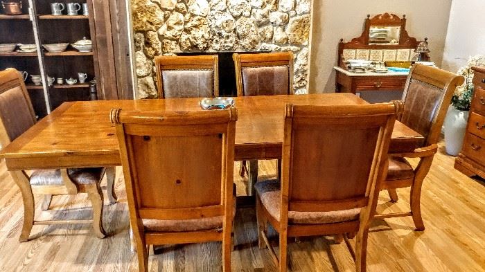 Knotty pine dining table with beautiful leather chairs