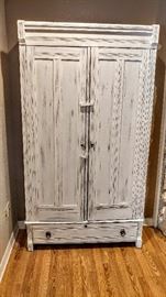 Vintage cabinet that has been distressed, over 100 years old, inside is stained.