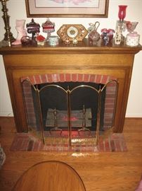 Nicest faux fireplace I've seen, wonderful mantle and electric logs. 