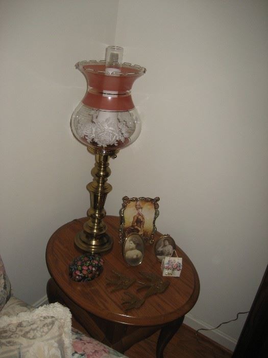 One of many hurricane style lamps, oak end table. 