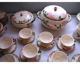 Quite a few larger serving pieces, Soup Tureen, Covered Casseroles, Relish Dishes,  Serving bowls and platters, creamers, sugar, and butter.  Over 160 pieces total. 