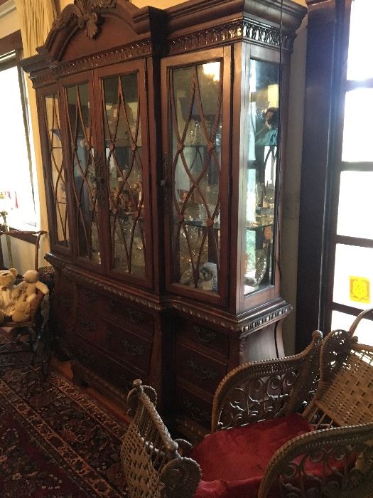 Beautiful china cabinet and antique baby carriage 