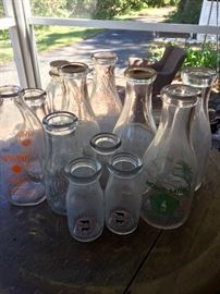 Vintage milk bottles and other bottles