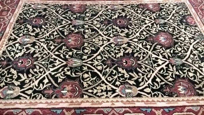 Power loomed oriental machine made high quality rug carpet.  