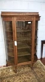 Antique round front hand carved china cabinet dating from the early 1900's. Other china and curio cabinets to choose from. 
