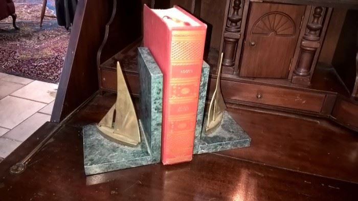 Marble and brass bookends to be sold. 