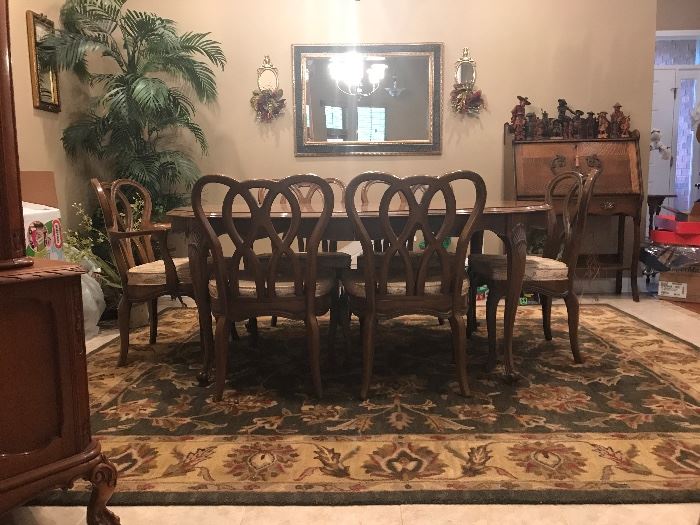 Mid Century Modern Dining Table & 8 Chairs ; shown here without the 2 leaves and 6 of the 8 chairs.  RUG IN PHOTO IS NOT FOR SALE.