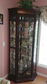 Large curio cabinet with modern sliding glass door