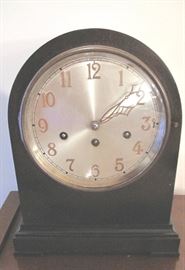 Junghans curved top mantle chiming clock.