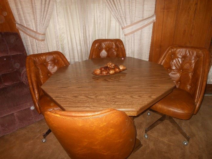 Octagon dining table and 4 swivel chairs