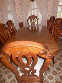 Dining table with 2 leaves and 6 chairs. ( will seat 12)
